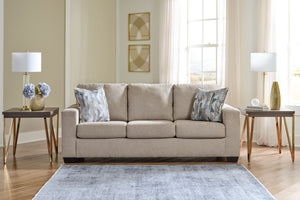  and the wide track arms are eager to support your quest for total relaxation. Distressed abstract toss pillows bring a fresh breath of contem