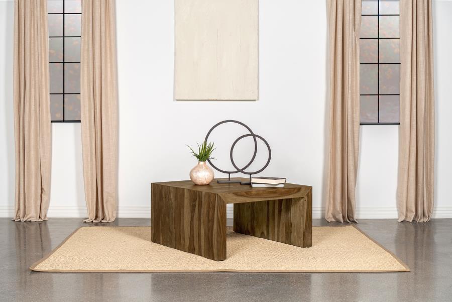 This square coffee table adds an earthy, organic vibe to any living space with its rustic charm. Crafted from sustainable solid sheesham wood, the table boasts an auburn finish that enhances its unique grain patterns. The U-shaped modern silhouette with m