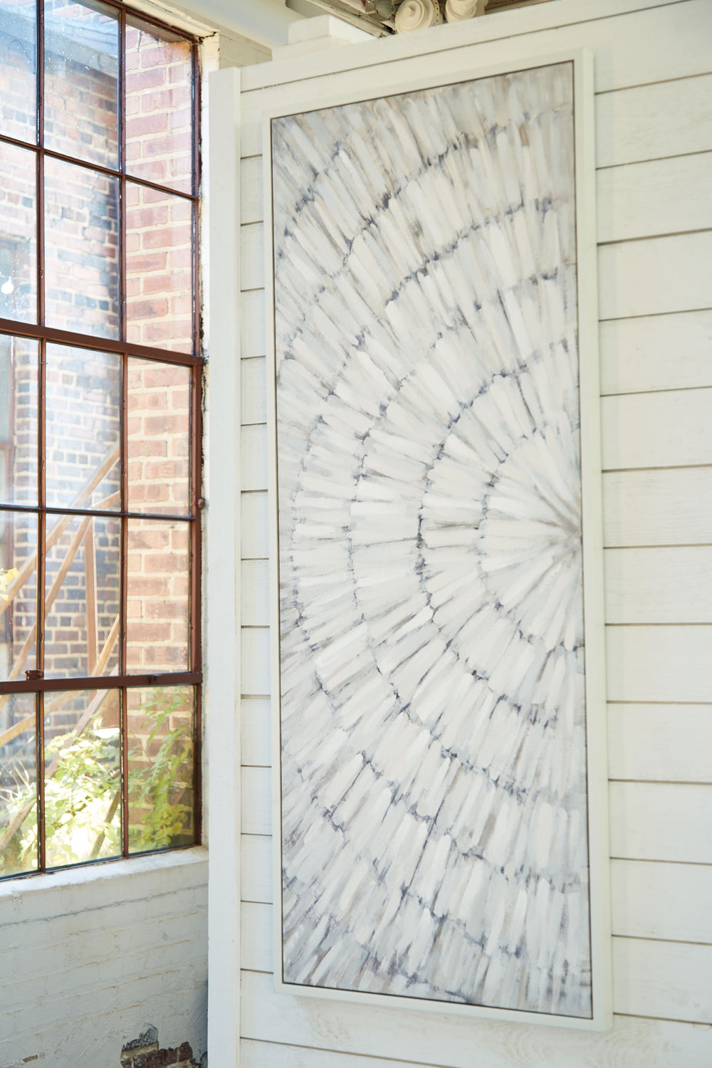 Bring a burst of brilliant-yet-subtle style to your space with this wall art. The abstract design has an almost three-dimensional quality, with paint strokes in soft shades of taupe, gray and white creating a textural look. Eye-catchingly modern, it-'s an
