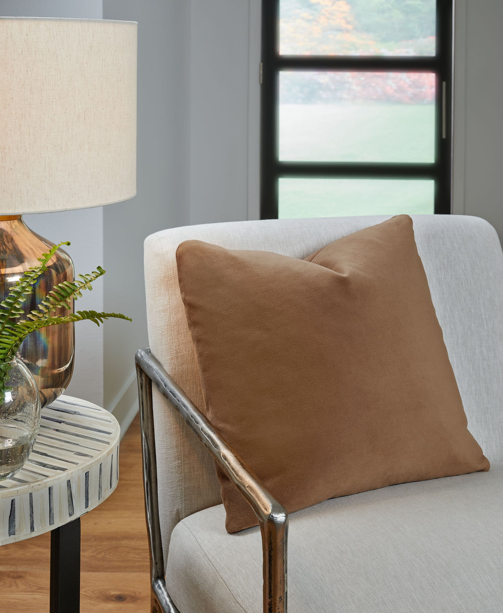 This pillow is made for lovers of luxe style and velvety comfort. Decadently soft in a shade of honey, itâ€™s an unassuming way to dress up your contemporary decor. Pair this pillow with pieces from the same palette, or use it to add a hint of color to a 
