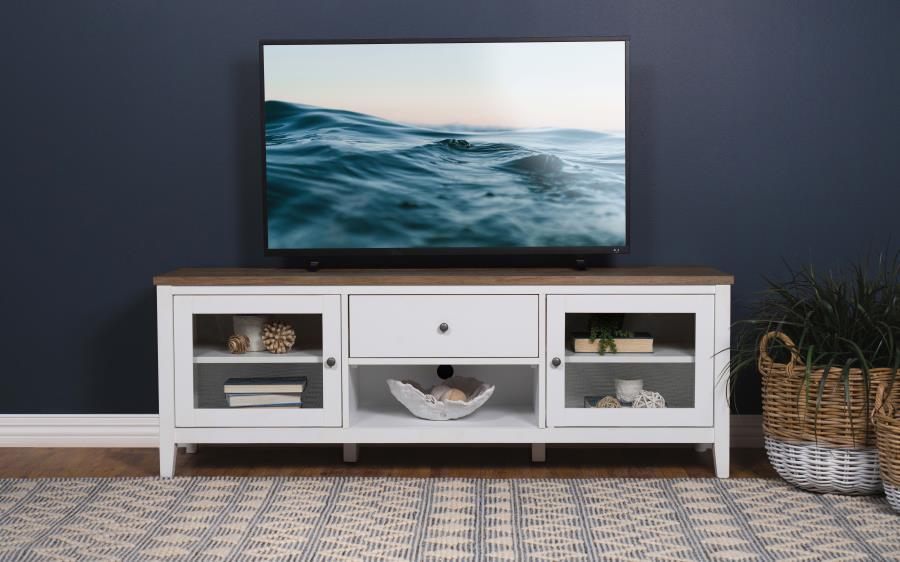 Versatility is a definite plus in the design of this charming transitional wood TV stand. Spacious and equipped with plenty of storage room, this console creates a breezy look with cottage, coastal, and farmhouse influence. A rectangular brown finish ash 