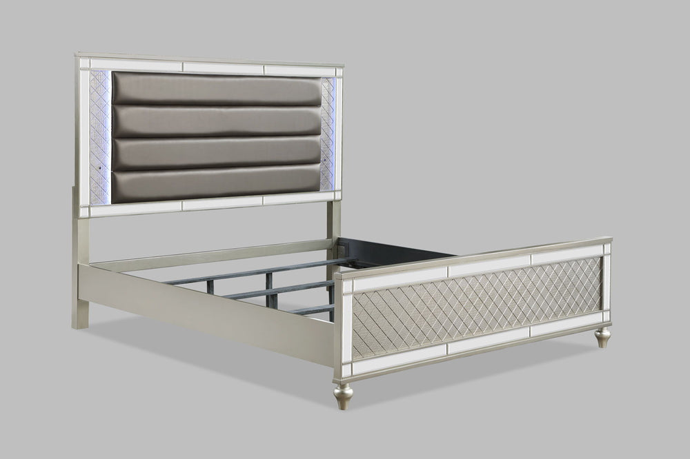 Elevate your sanctuary with this dazzling bedroom collection, where contemporary chic meets timeless charm. The suite boasts a stunning silver finish, imbuing your space with an air of sophistication and modern luxury. At the heart lies a plush, channel t