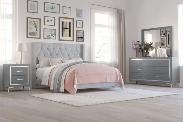 The Huxley 4-Piece Bedroom Set in Gray offers a stylish blend of contemporary glam and durable construction for a sophisticated bedroom. This set includes a 6/6 King upholstered bed with headboard, footboard, two side rails, and slat kit, along with a 6-d
