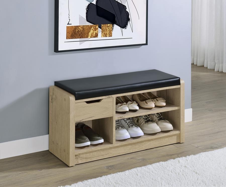 Make your entryway or garage both functional and stylish with this versatile storage bench, designed to keep your space organized. Featuring a foam cushion upholstered in sleek black faux leather, this bench offers a comfortable seat while you put on or t