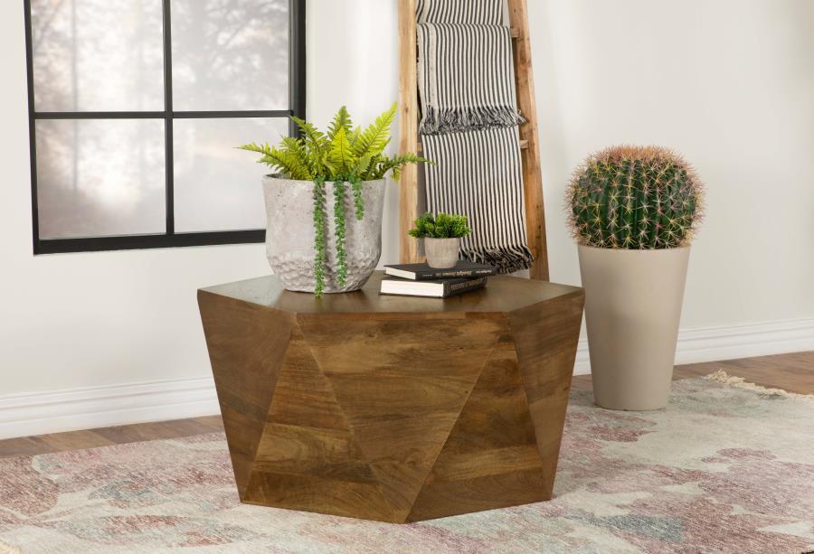 This striking, modern coffee table makes a charming addition to a boho-inspired home or modern farmhouse living room. Designed as a hexagonal shape, this mango wood coffee table offers triangular facets all around the sides for striking visual interest. T
