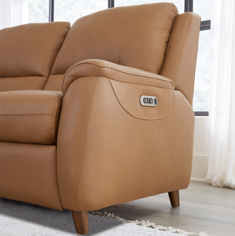 The Austin power reclining group is designed for ultimate comfort and convenience. It features independently operating power headrests and is upholstered in supple leather with a custom match. The modern high-leg design in a warm walnut finish gives it a 