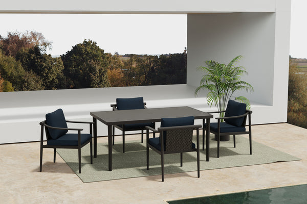  featuring a durable table and four side chairs with comfortable blue cushions. The aluminum frames boast a baked-on powder coat finish