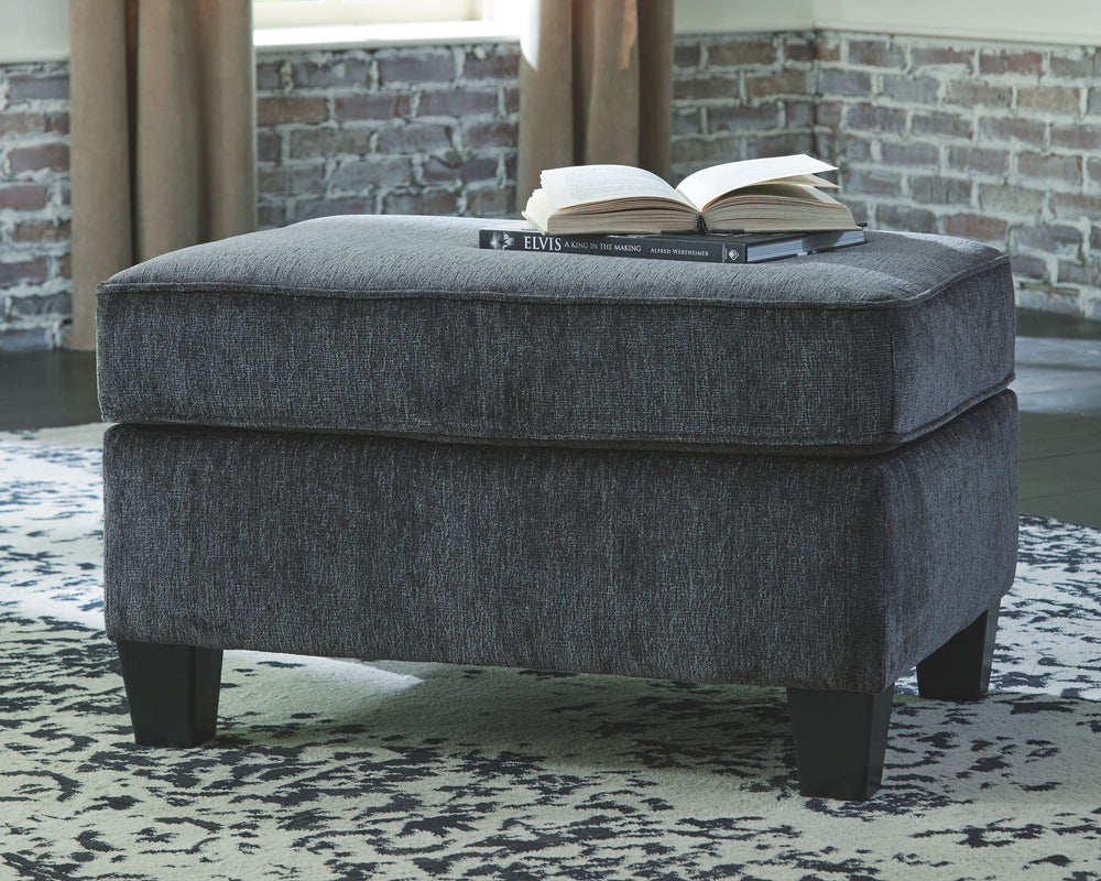 If youâ€™re looking for a smokinâ€™ hot look priced to entice, youâ€™re sure to find this ottoman beautifully fits the bill. Covered in a smoke gray chenille upholstery loaded with plush texture, this less-is-more contemporary ottoman is one sensational s
