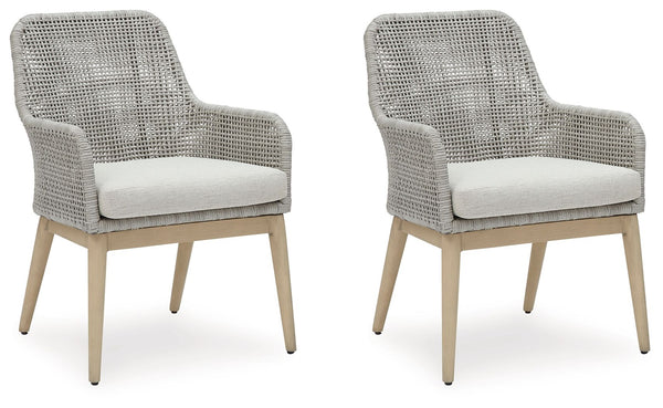 This dining arm chair invites your casual contemporary style outdoors. With its resin wicker in a chic neutral hue, it expertly marries refined design with durability. Breezy summer mornings and cold winter nights are made all the more comfortable with hi