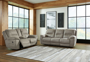 Kick back, relax, and enjoy some sports on TV with this reclining set. You will love its double stuffed pillow top arms and soft-as-suede faux leather upholstery. Family-friendly dark gray color and creative stitching add panache. Recline in infinite posi