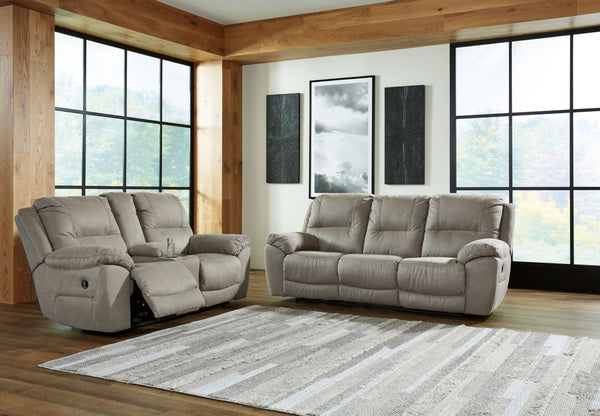 Kick back, relax, and enjoy some sports on TV with this reclining set. You will love its double stuffed pillow top arms and soft-as-suede faux leather upholstery. Family-friendly dark gray color and creative stitching add panache. Recline in infinite posi