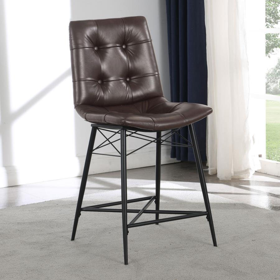 Cool and cozy, this counter height stool is the ultimate dining room upgrade. The padded seat is wrapped in smooth leatherette for an inviting look and feel. Button tufting adds a subtle, decorative touch. A sleek, metal base gives it a modern look while 