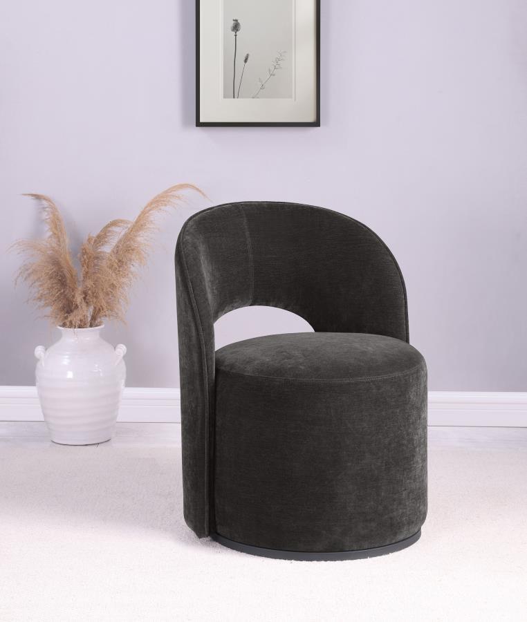 This contemporary swivel accent chair blends style and comfort, featuring luxurious velvet upholstery. Its curved silhouette and 360-degree rotation enhance versatile seating arrangements. Perfect for a living room corner or reading nook, it creates a plu