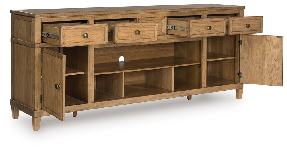 Taking a timeless approach to casual beauty, this TV stand brings easygoing elegance to the everyday. The light brown wood-tone finish seamlessly slips into your roomâ€™s aesthetic. Two spacious cabinets (each with an adjustable shelf), four drawers and a