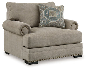 Looking to enhance your home-'s visual appeal? This oversized chair offers sophisticated design, comfort and elegance with tonal colors, roll arms and nailhead accents. Enjoy optimal coziness as you nestle into luxurious soft upholstery and feather-blend 