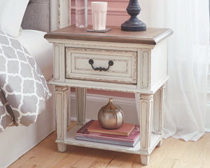  this nightstand is your dream bedroom retreat realized. Antiqued two-tone aesthetic blends a chipped white with a distressed wood finished top for added charm. Adorned with classic bail pull hardware
