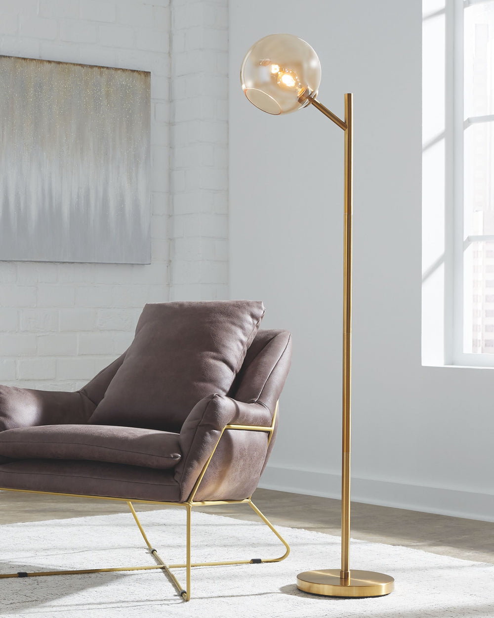The added functionality of this floor lamp was smartly designed to shine light where you need it most without compromising style. The glass shade brings a fresh take on this design making it the ideal lamp for your living room, reading nook or office.<br>