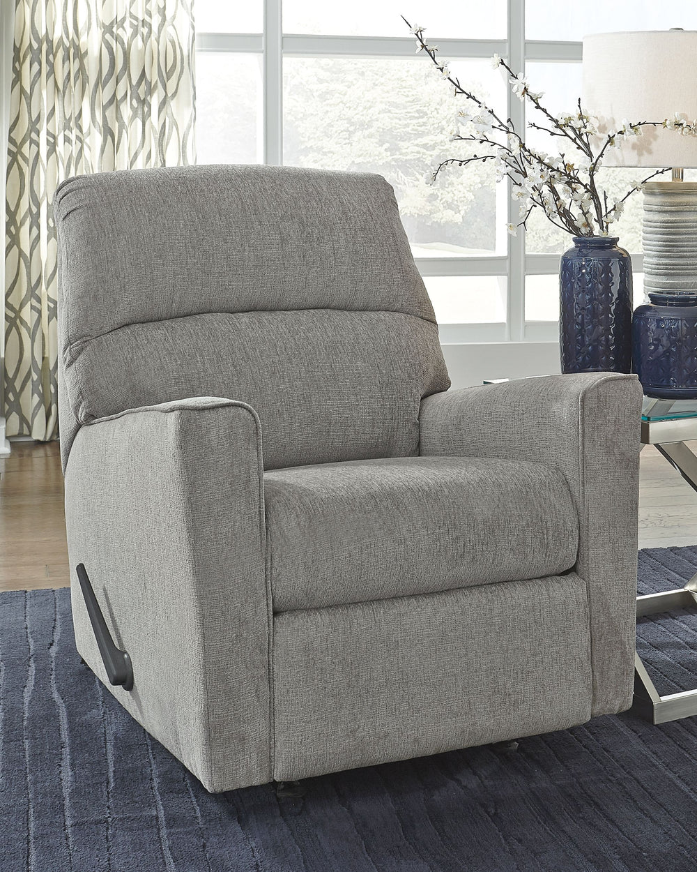  then this rocker recliner is the answer. Clean-lined profile is beautifully contemporary. Plush chenille fabric and plump cushioning make it so easy to comfortably kick up your heels. Richly neutral hue complements a variety of d