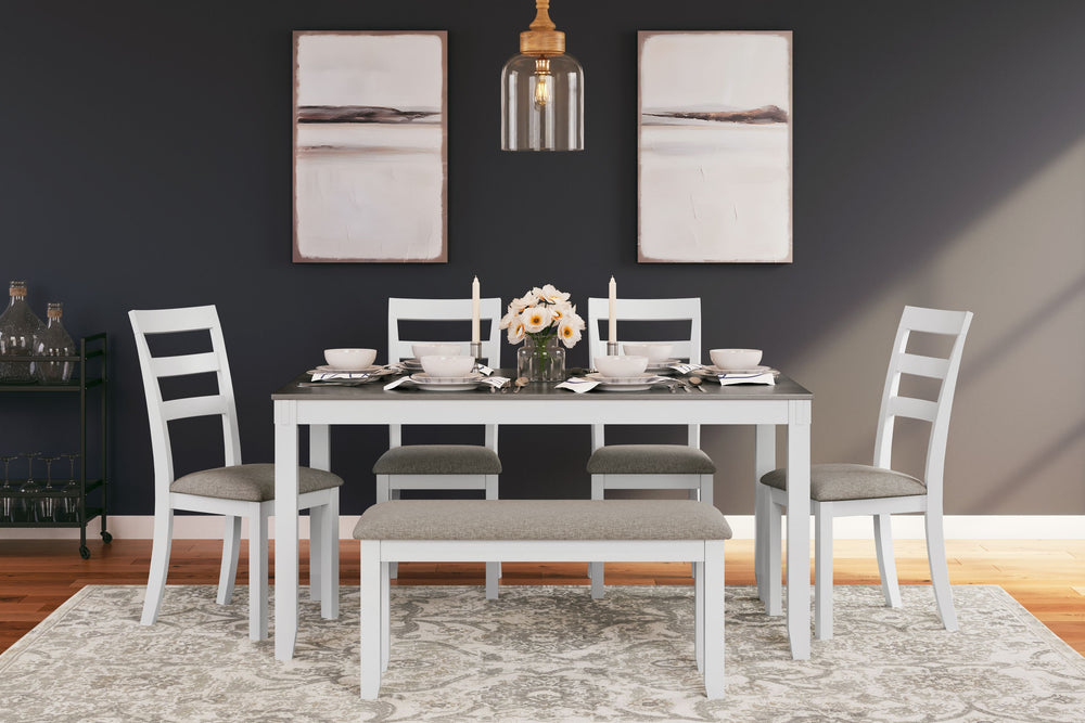 Feast your eyes on how beautiful simplicity can be. This dining set creates a cohesive, modern farmhouse feel with its clean-lined profile and chic two-tone color scheme. Its upholstered ladderback chairs are such a classic, while the addition of a comfor
