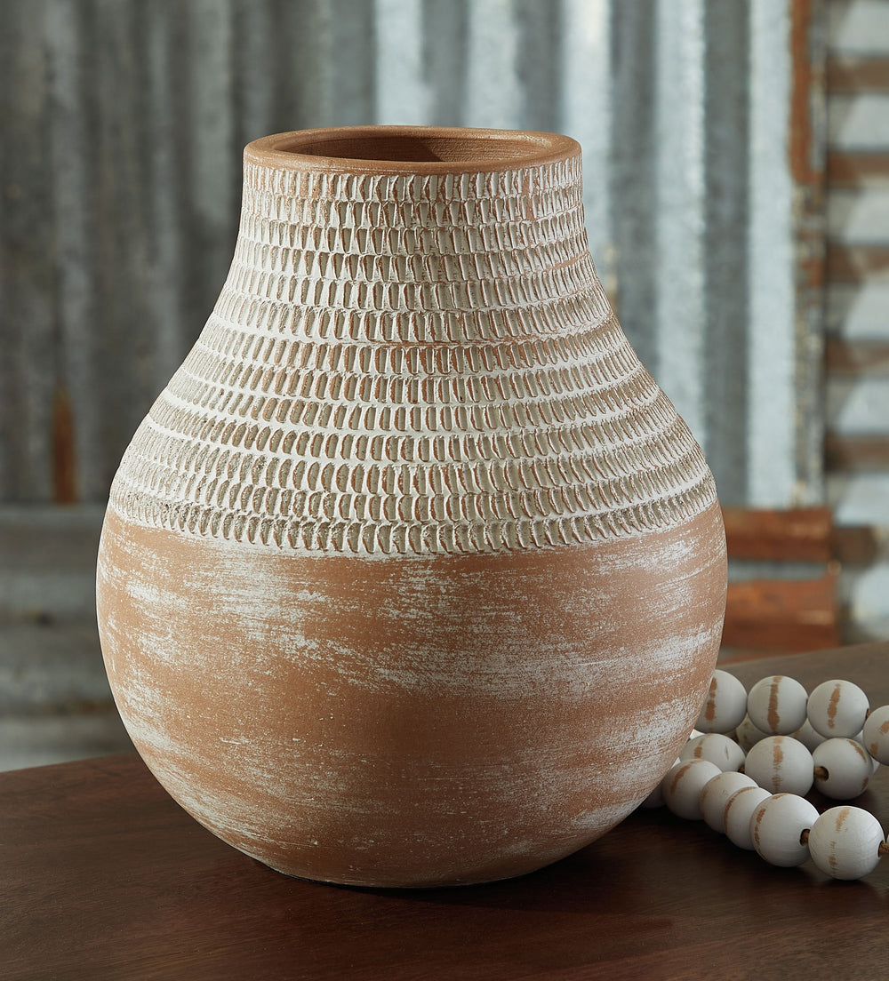 Casual, earthy design comes to life with this terra cotta vase. A distressed white patina is the perfect finish for this piece, giving it an understated presence to stand alone or in pairs on a shelf or display space.<br/><br/><b>Product Features</b><ul><