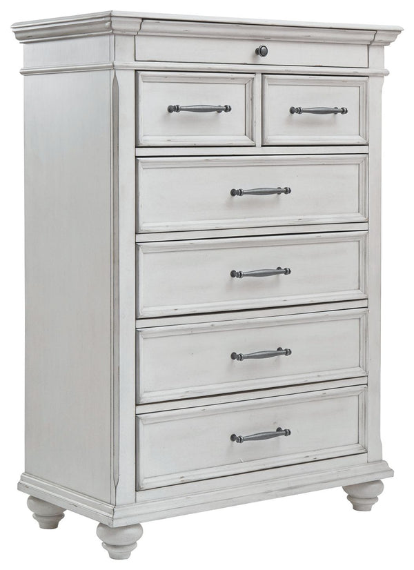 Give your retreat vintage charm with this chest. Sporting a beautifully distressed whitewash finish, it includes seven varied-sized drawers for an organized wardrobe. Generously scaled moulding from top to bottom, along with bun feet and drawer handles wi