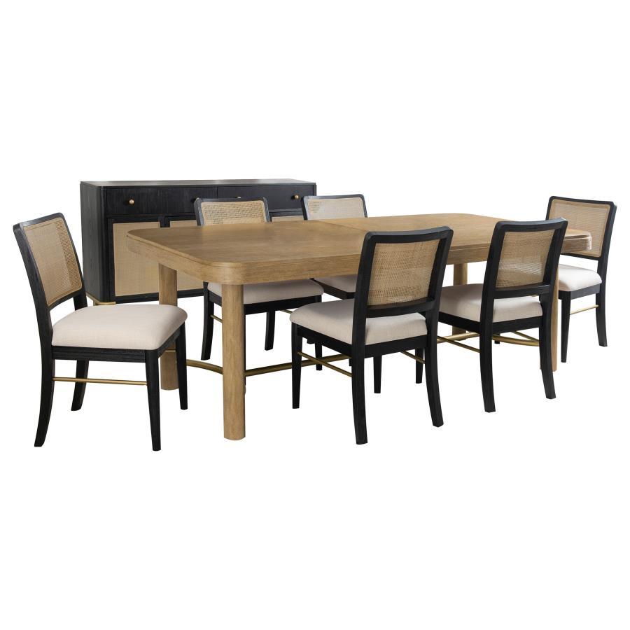 This dining set blends modern craftsmanship with natural textures for a refined yet inviting feel. The dining table features a trestle base with an antique brass-finished metal stretcher bar, adding stability and contrast. Rounded corners soften the recta