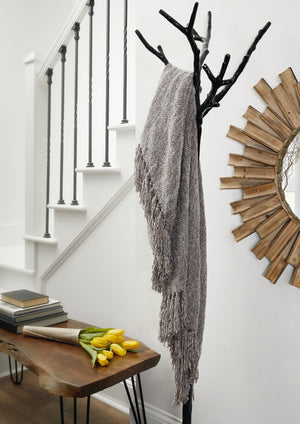  this gray throw blanket also makes a stylish statement. Whether draped over the arm of a sofa or folded at the foot of a bed