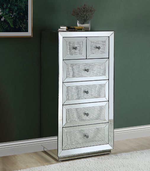 The Ornat Cabinet will add a contemporary touch to any room in your home. With its clean lines and faux diamonds inlay, this brilliant cabinet showcases a distinctive style for an intriguing look. The table features six storage drawers with safety stop an
