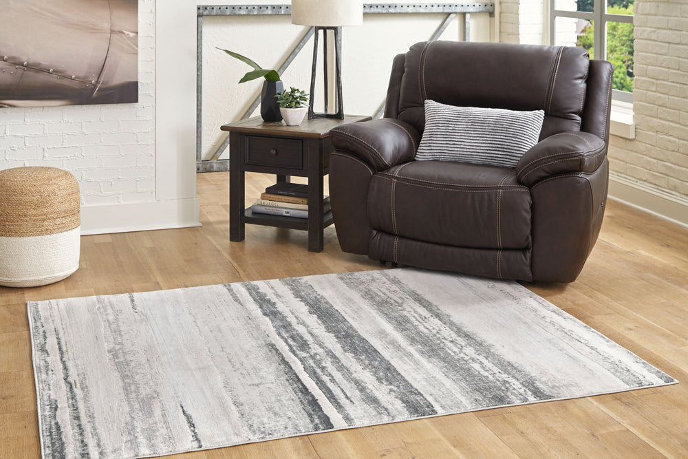 Set off your decor in sophisticated style with this area rug. With a high-low abstract design in cream, gold, sage and shades of gray, it complements a variety of interior design themes.<br/><br/><b>Product Features</b><ul><li>Made of heat set polypropyle