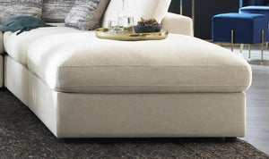  designed to blend seamlessly with modular setups or stand out on its own. Wrapped in a beige linen-blend fabric