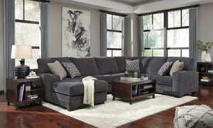  the sectionalâ€™s slate gray upholstery is