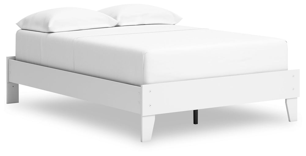  the low-profile bed frame fits right in with your minimalist 