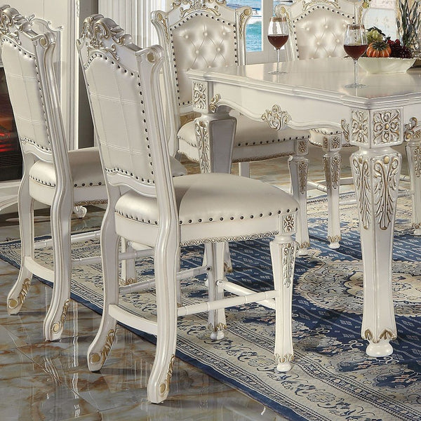KD, Armless Chair Padded Seat & Back Cushion: PU with Nailhead Trim (Button Tufted Inside Backrest) Wooden Seat Apron with Molding Trim Wooden Tapered Leg & Footrest Supports: Floral Motif