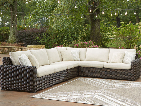  comfort and durability to alfresco fun. This outdoor sectional captures the textural beauty of wicker while withstanding the elements