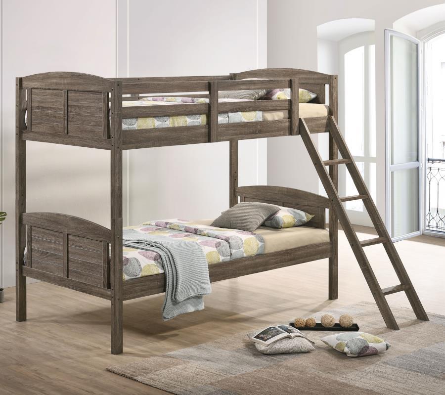 A casual country vibe carries the space with this rustic bunk bed, perfect for compact bedrooms and shared sibling spaces. A weathered brown finish lends a neutral hue to transform a space into a serene, restful retreat. Along the top bunk are safety guar