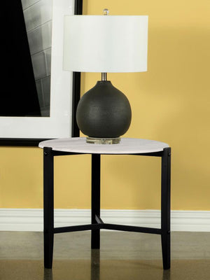  featuring a minimalist design. Its slim black solid rubberwood legs form a tripod-like base