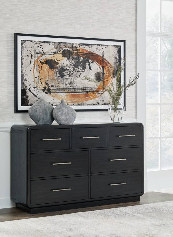  this softly shaped dresser makes a lasting impression in a simply stunning way. Its magnificent curved silhouette is enhanced by a rich layered black finish on the textured wood grain surface. This is the statement piece youâ€