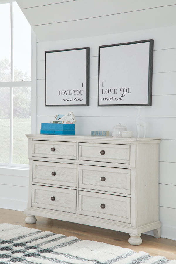  while drawers with dark bronze-tone knobs add a sophisticat