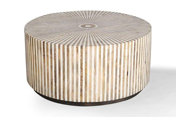  the Downtown round cocktail table offers a casual luxury with a youthful