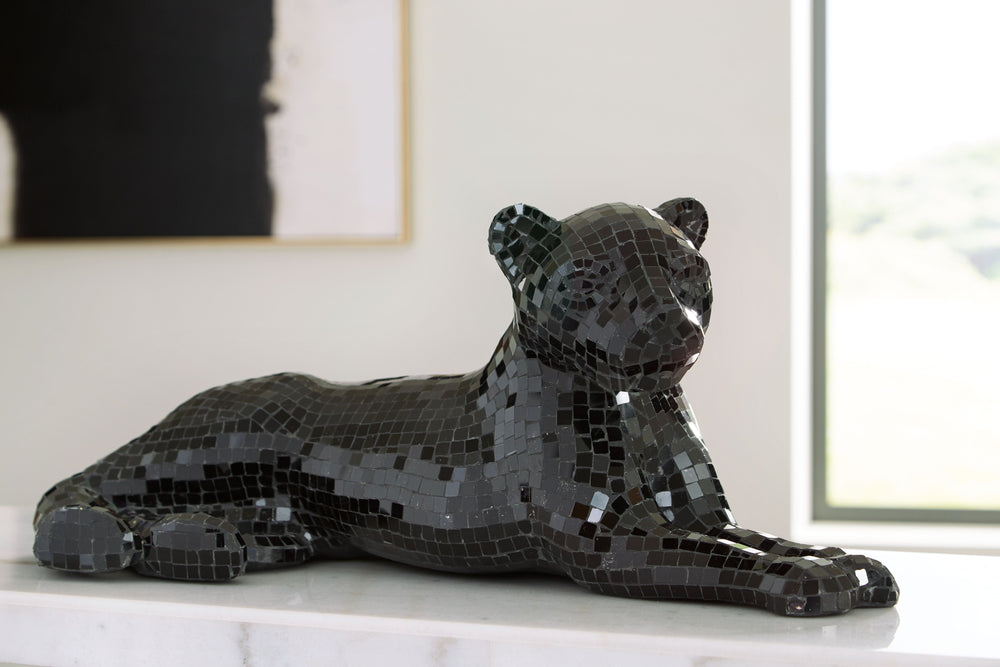 Decorate your home with this iconic mixed-media sculpture. Handcrafted with a mosaic glass and paper composite, this panther will add an exotic element to any space. Create a fierce look in your bedroom, or a luxurious allure in your living room, with thi