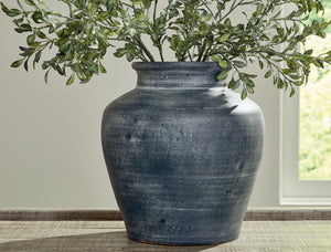  this vase offers a traditional feel courtesy of its terra cotta construction. The antiqued look is brought into the present with a distressed blue hue. It-'s an effortless way to elevate a centerpiece