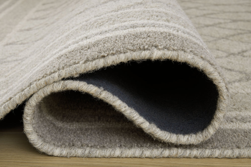 Experience traditional style made modern. Beautifully crafted with wool, this rug creates a soft, textured feel underfoot. Whatâ€™s more, its muted pattern and hues are versatile enough to accommodate seasonal updates while also providing the perfect year