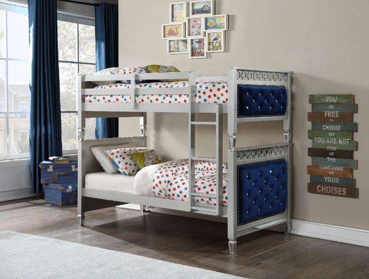Fulfill your children-'s dreams of being royalty with this Varian twin over twin bunk bed and trundle. With elegant details such as a silver finish, button-tufted velvet upholstered headboard and footboard panels, and beautifully tapered legs, all add to 