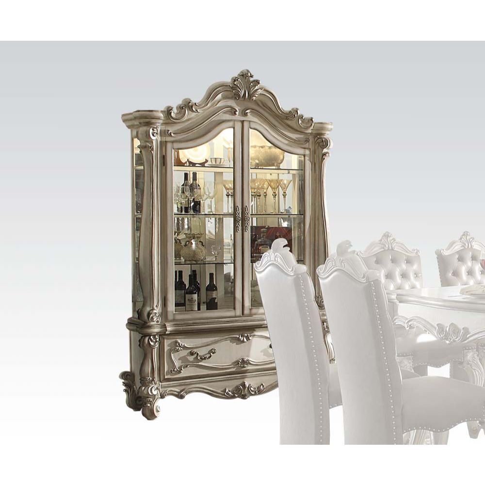 Curio Cabinet Arched Top: Touch Light & 2 Glass Doors (3 Glass Shelves & Back Mirror Inside) Base: 1 Drw Oversized Scrolled Trim, Leaf Crown and Post-Leg (Poly Resin with Antique Contrast Finish) Drawer: GLIDE Side Metal, DT French, Felt-Lined Included<br