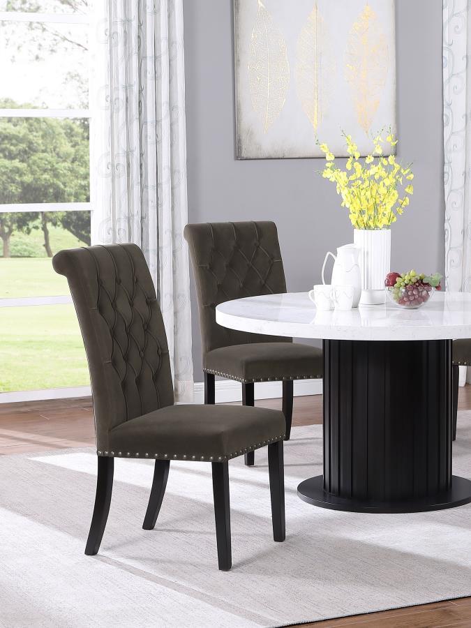 Blending timeless elegance with plush comfort, this side chair enhances any dining space. Its high backrest features a classic button-tufted design, adding depth and sophistication. A rolled top and hand-applied nailhead trim create refined detailing, whi