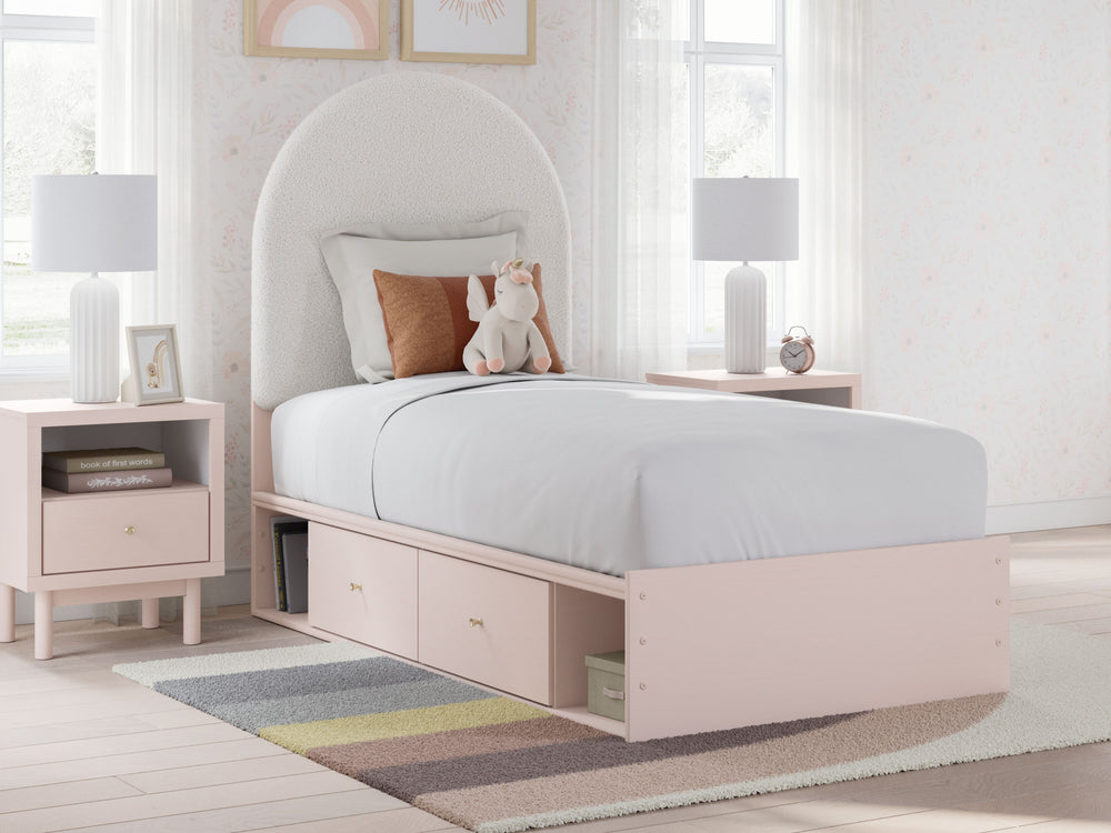 Pretty in pink. This twin upholstered panel bed with storage keeps the spirit of your homeâ€™s modern aesthetic while suiting all your young oneâ€™s needs. Its cozy-cute upholstery and subtle blush finish bring a playful, charming vibe to bedtime. Made fo