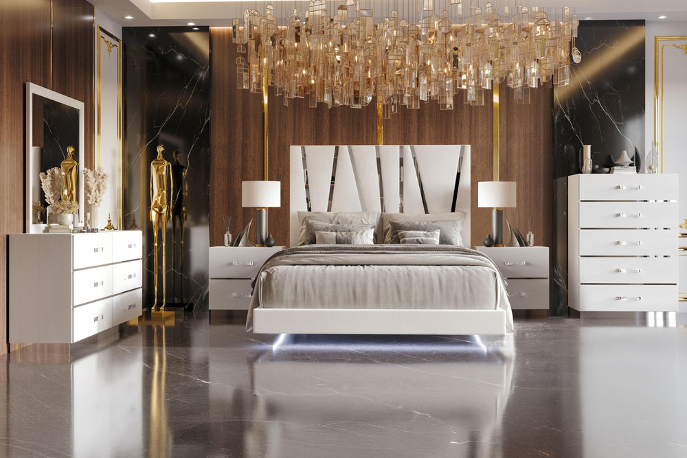 The Europa 6 Piece Bedroom Set in white brings modern elegance and practical functionality to your bedroom. This set includes a panel bed as well as a dresser, mirror, 2 nightstands and a chest. The sleek design features a majestic headboard, glossy white