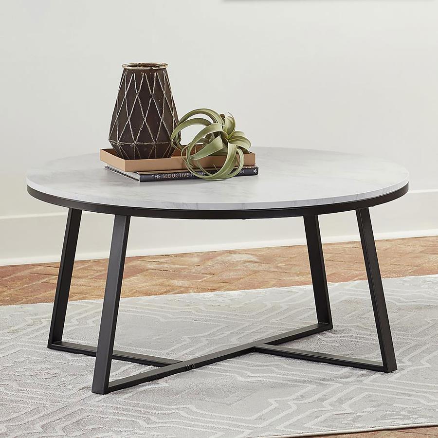 This round coffee table offers a modern two-tone design, perfect for any contemporary living space. Its white faux marble top delivers a sleek, sophisticated look, beautifully complemented by a matte black powder-coated metal base. The intersecting U-shap