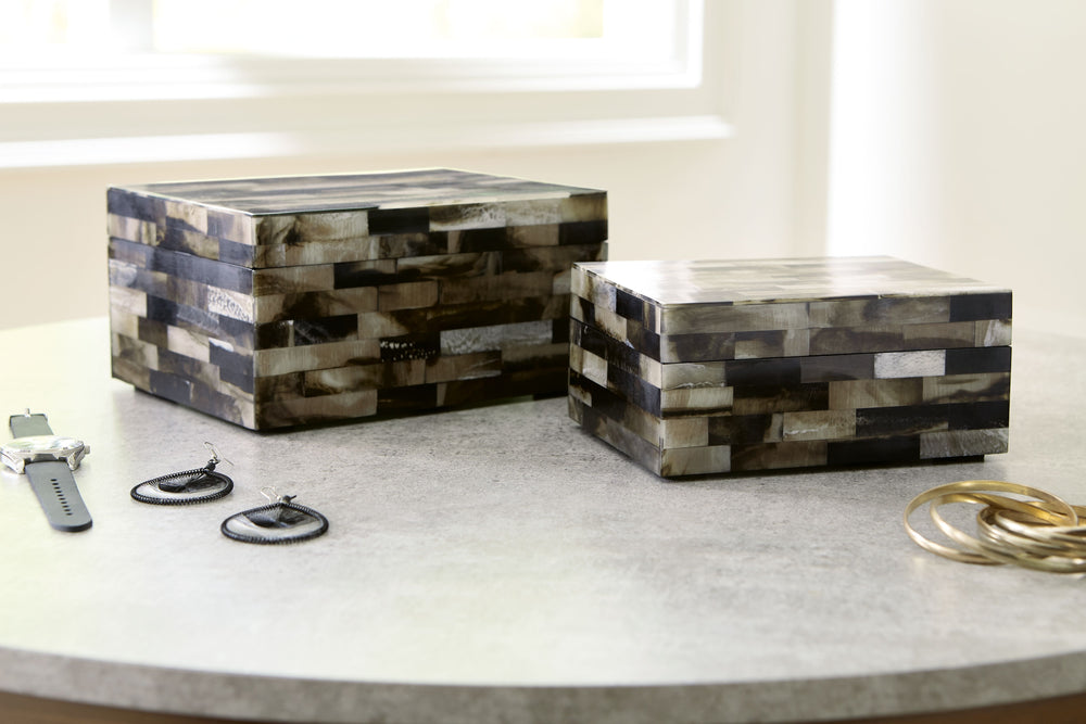 This mosaic patterned box set is a masterful interpretation of neutral hues. A stylish habitat to hide your tiny treasures, the set can store jewelry and accessories (along with other odds and ends), keeping clutter off the tops of your dressers and accen