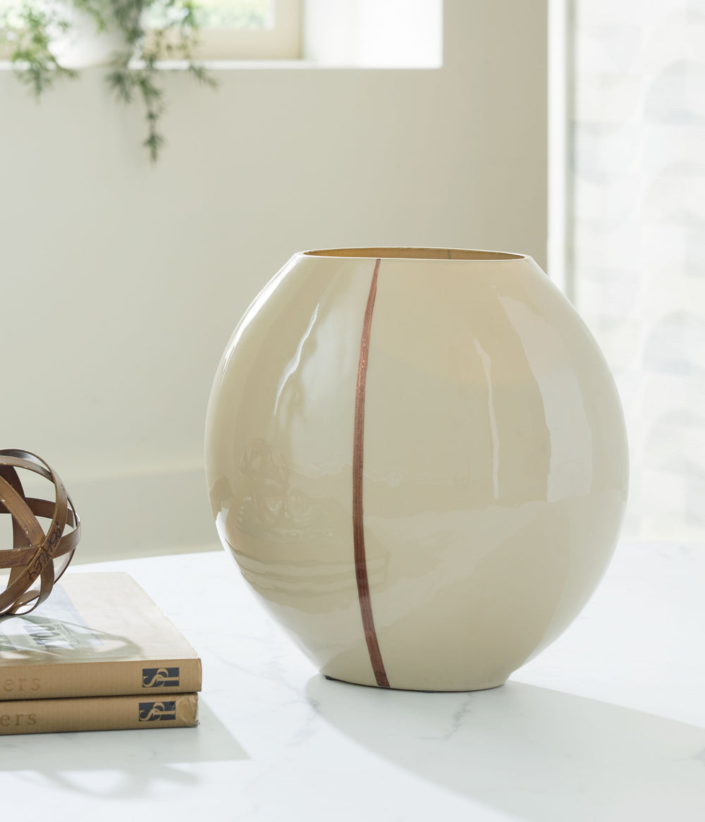 Create a contemporary vibe for your coffee table, shelf or foyer with this vase. An eye-catching metallic accent showcases its softly rounded shape, bringing a modern flair to the otherwise timeless form. The vase serves as a sculptural accent on its own,